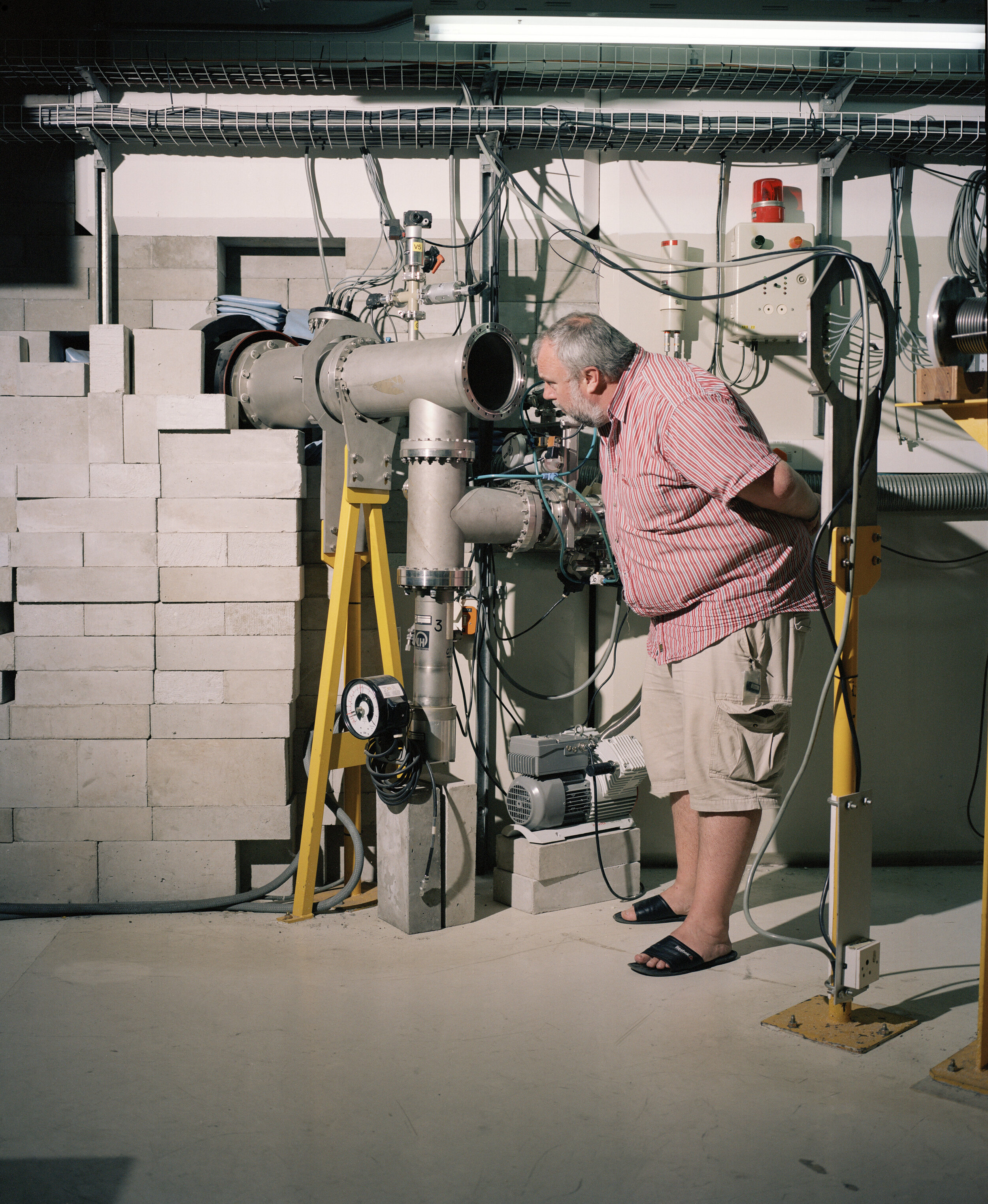 Dr Pete Jones in one of the experimental area at iThemba LABS checking the end of a beam line (called beam-dump). This part is where the accelerated charged particles that haven’t interact with the target nuclei are stopped.